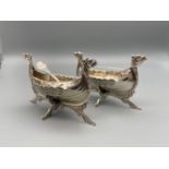 A Pair of Scandinavian silver longboat salts with glass liners and matching spoons. Marked 830 S Lo.