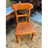 A Victorian bar back chair. Supported on turned legs. Stamped [48] underneath.