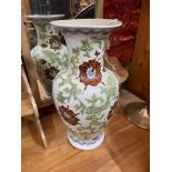 A 20th century oriental glazed floral design vase.