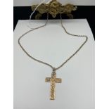 A 9ct gold cross pendant together with a 9ct gold chain. [Total weight 8.05grams] [Chain 20 inch]