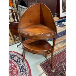 A Georgian mahogany corner wash stand. designed with one single drawer and two false drawers. Lift