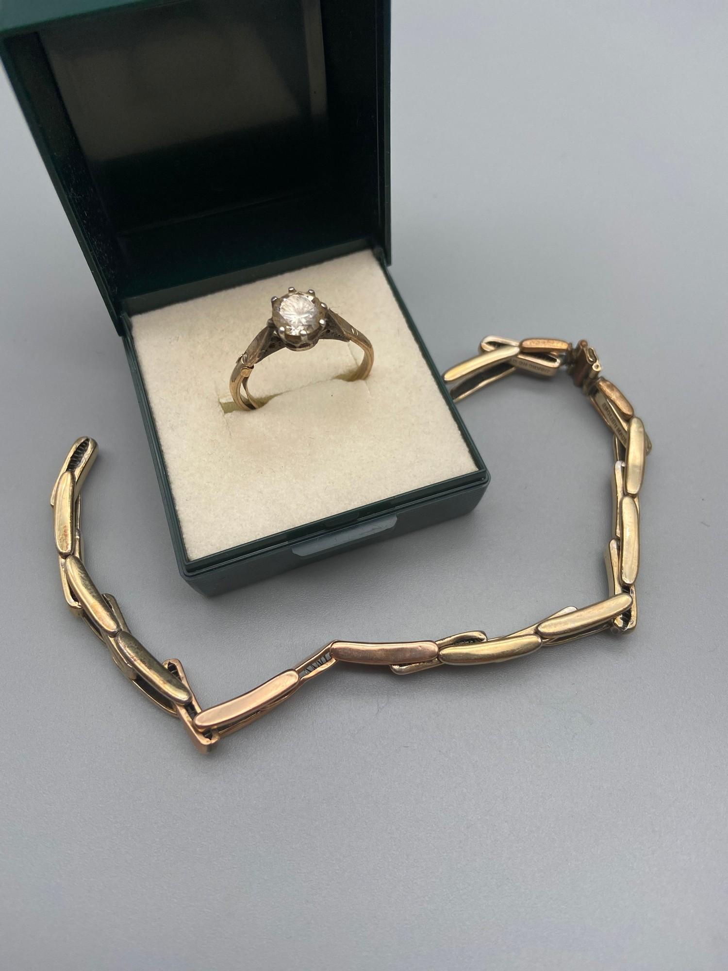 A Gold on Silver ladies ring set with a large clear stone. Together with a gold on silver watch
