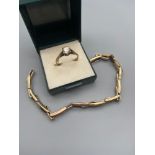 A Gold on Silver ladies ring set with a large clear stone. Together with a gold on silver watch