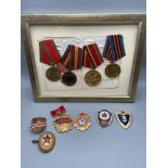 A Quantity of Russian military medals and cap badges