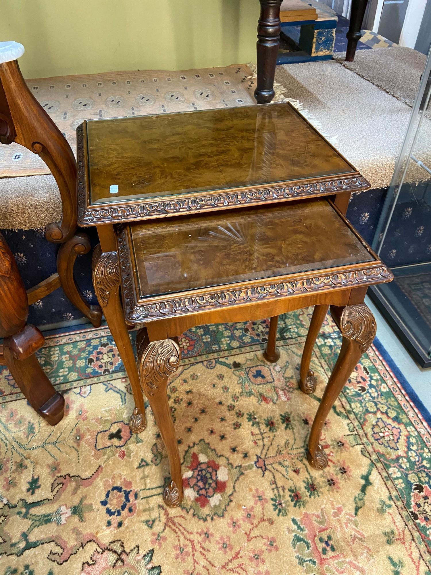 A Set of reproduction burr walnut [2] nest of tables fitted with bevel glass insert tops.