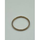 A Gold band ring stamped '333' [Weighs 1.85 grams] [Ring size X]