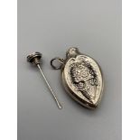 A Silver 925 ornate pendant scent bottle. Detailed with an urn of flowers to each panel. [4.5cm]