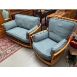 A Vintage Ercol Renaissance light wood framed two seat sofa and single chair.