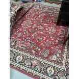 A Large red ground antique rug.