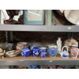 A Shelf of oriental collectable porcelain which include Japanese hand painted bulbous satsuma