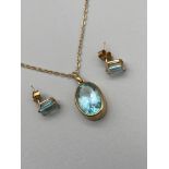 A 9ct gold necklace, 9ct gold and large Blue Topaz stone pendant together with a pair of 9ct gold