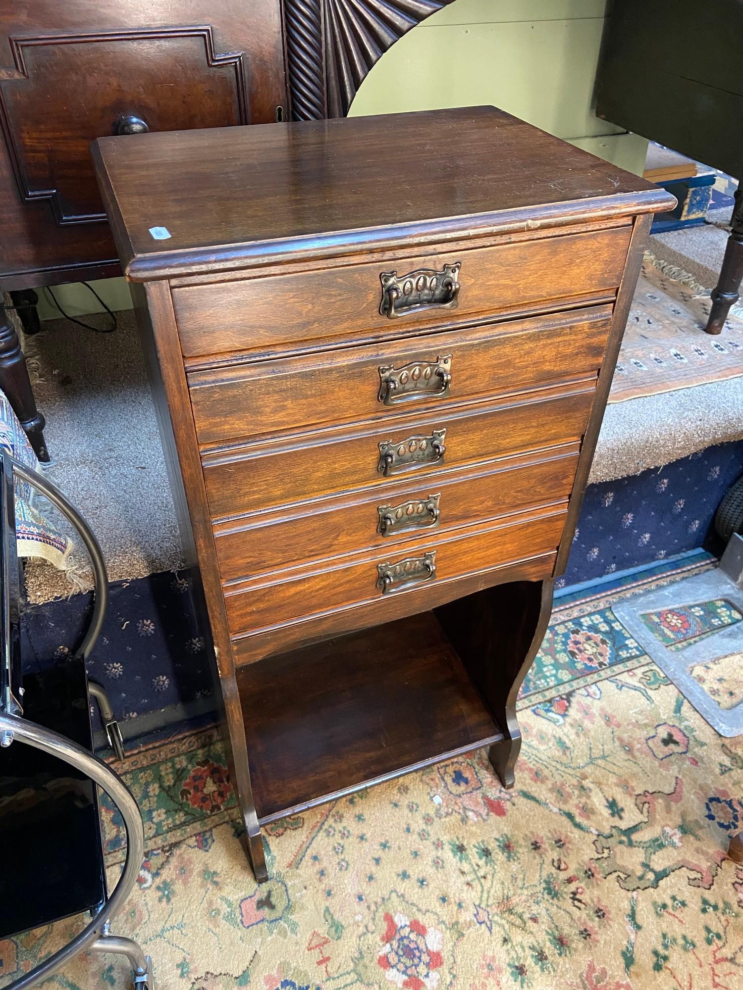 An early 1910/20's music cabinet. Designed with 5 drop end drawers and fitted with Art Nouveau