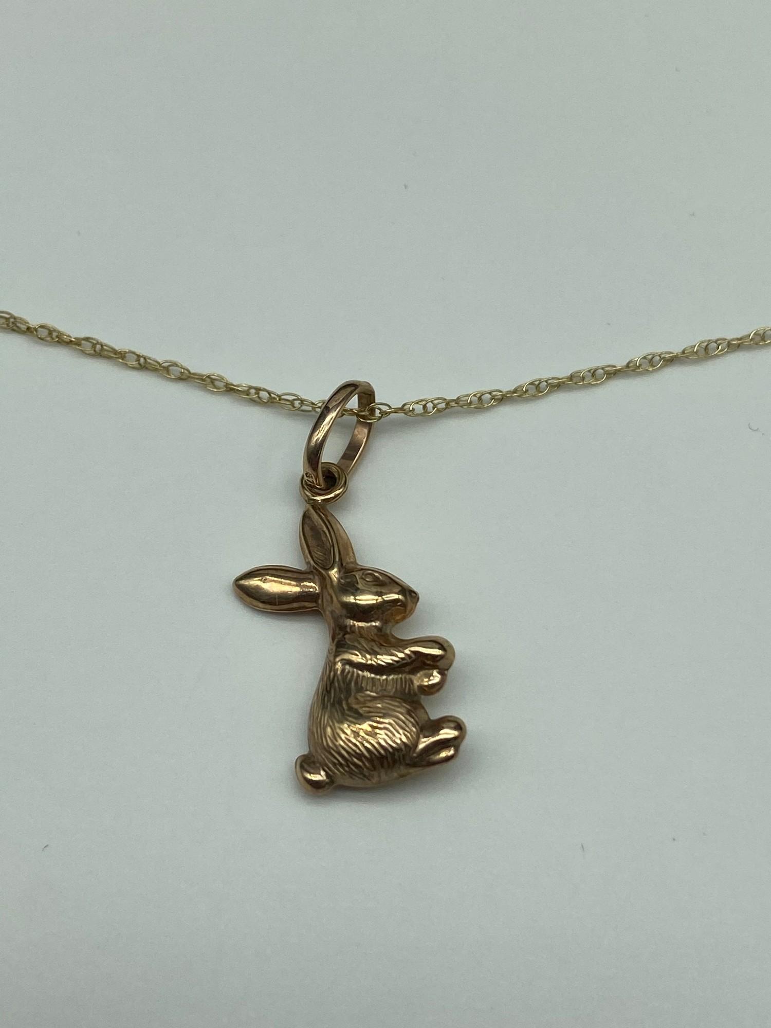 A 9ct gold rabbit pendant with a 9ct gold necklace. [Weighs 1.53 grams] [16 inch chain] - Image 2 of 2