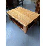 A Solid pine lounge table.
