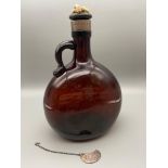 A Victorian brown glass whisky flagon designed with a possible silver collar, Also comes with a
