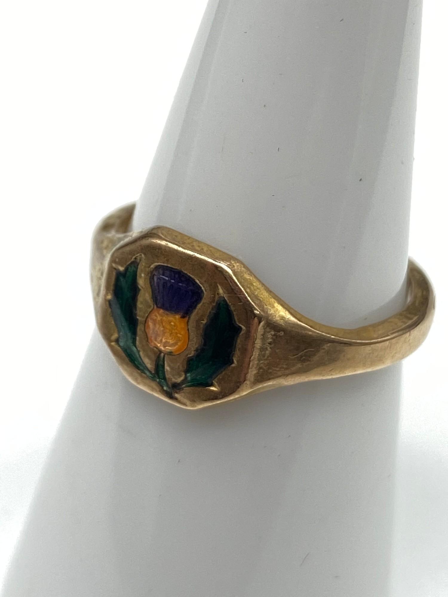 A Possible Gold signet ring designed with enamel painted thistle. [Weighs 2.17 grams] [Ring size M]