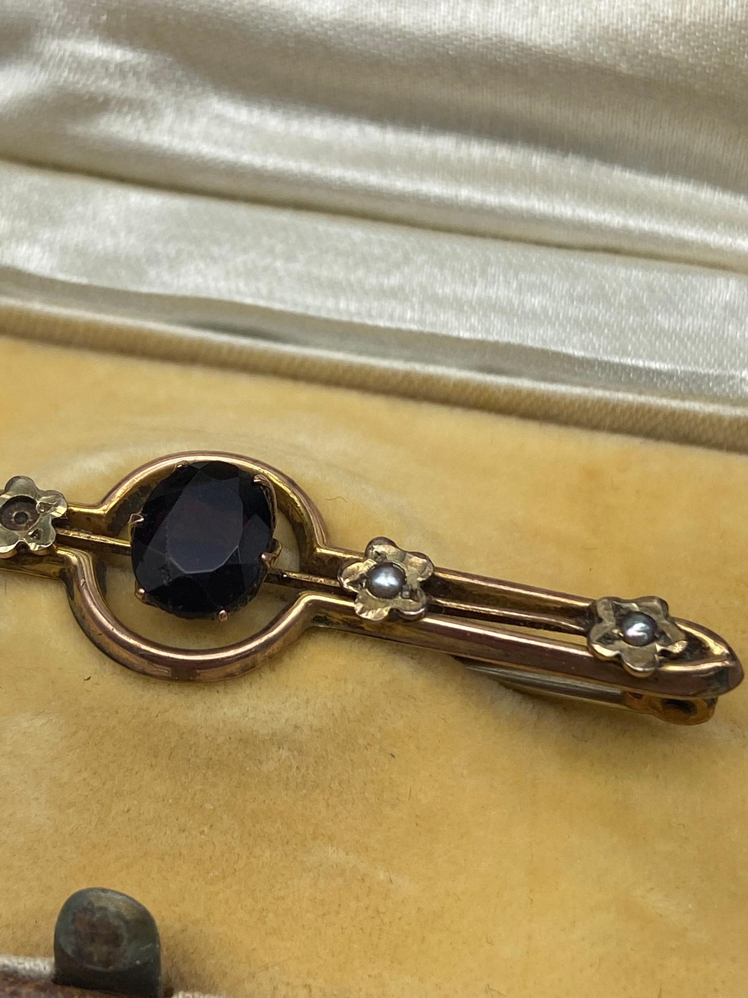 A Ladies antique 9ct gold bar brooch set with three seed pearls [one missing] and a large Amethyst - Image 2 of 5