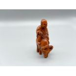 Japanese hand carved netsuke of a gentleman riding an ox, signed by the artist [5.2cm]