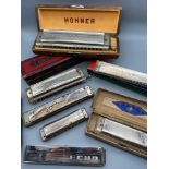 A Collection of 7 various Hohner harmonicas which includes two Echo's, The Chromonica & II, Echo