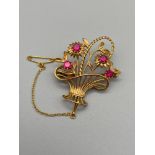 A High grade gold [18-24ct unmarked] Basket of flower design brooch set with four large ruby
