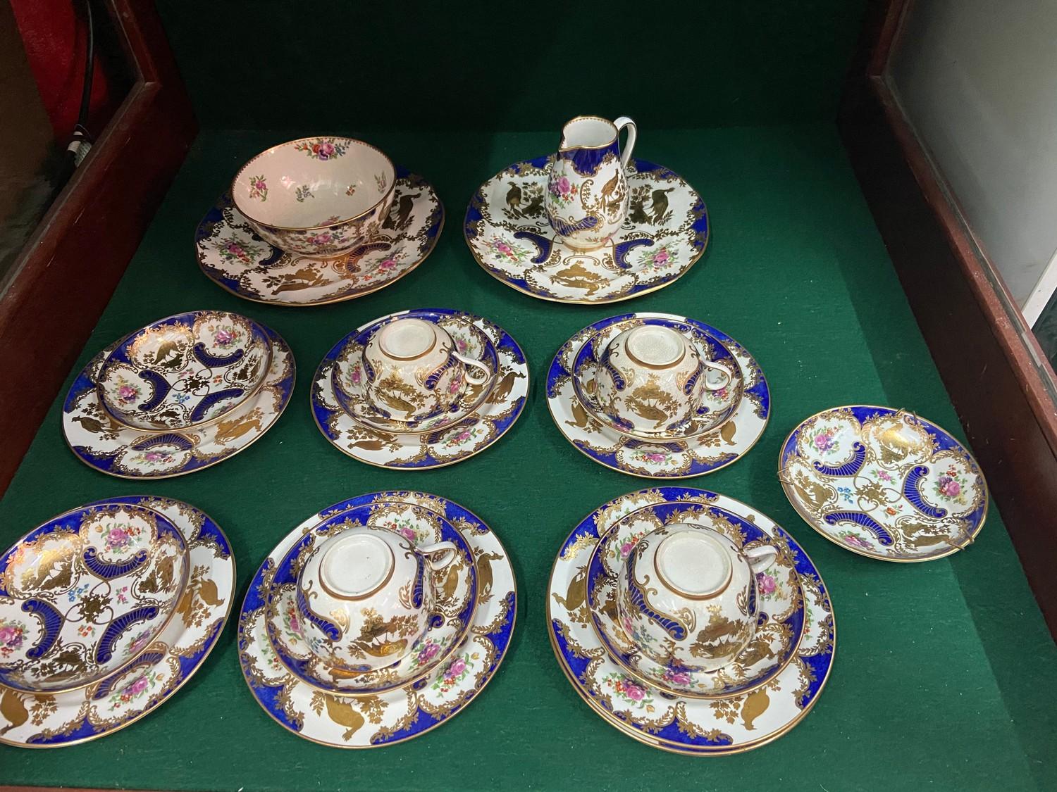 A 19th century Booths Gilt peacock design part tea set [22 pieces]