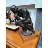 Austin Sculptures 'The Thinker' sculpture. dated 1999. Sat upon a wooden block. [31cm height]