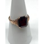 An Antique 9ct gold ring set with a cushion cut red garnet stone. [Stone 10x8mm] [ Weighs 2.13