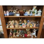 Three Shelves of collectable porcelains which include Pendelfin Rabbits and houses. Pets with