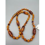 A Vintage Bakelite amber bead necklace