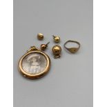A Lot of Gold which includes A Victorian 9ct gold mourning pendant, 9ct football charm, A Pair of