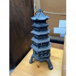 A Vintage cast iron pagoda tower candle holder.