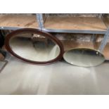 Antique dark wood framed oval mirror together with an Art Deco wall mirror.
