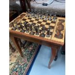 A Vintage inlaid music chess top table together with Greek cast metal chess set and wooden carved