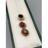 A Pair of 9ct gold and garnet earrings together with a 9ct gold and garnet pendant.