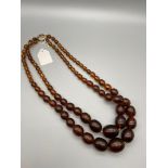 A vintage Bakelite amber graduating bead necklace