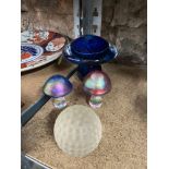 A Lot of three art glass mushroom paperweights and frosted glass golf ball paperweight.