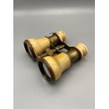 A Pair of Victorian brass & Ivory covered opera glasses.