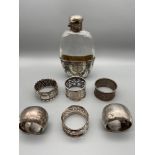 A Lot of 6 various Birmingham silver napkin rings, Together with an ornate plated and glass hip