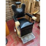 A Vintage 1920's Barber Chair manufactured by Theo A Kochs Company Chigago. Designed with black