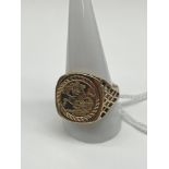 A 9ct gold Gent's St George Medal Ring. [Size W, Weighs 6.42 grams]