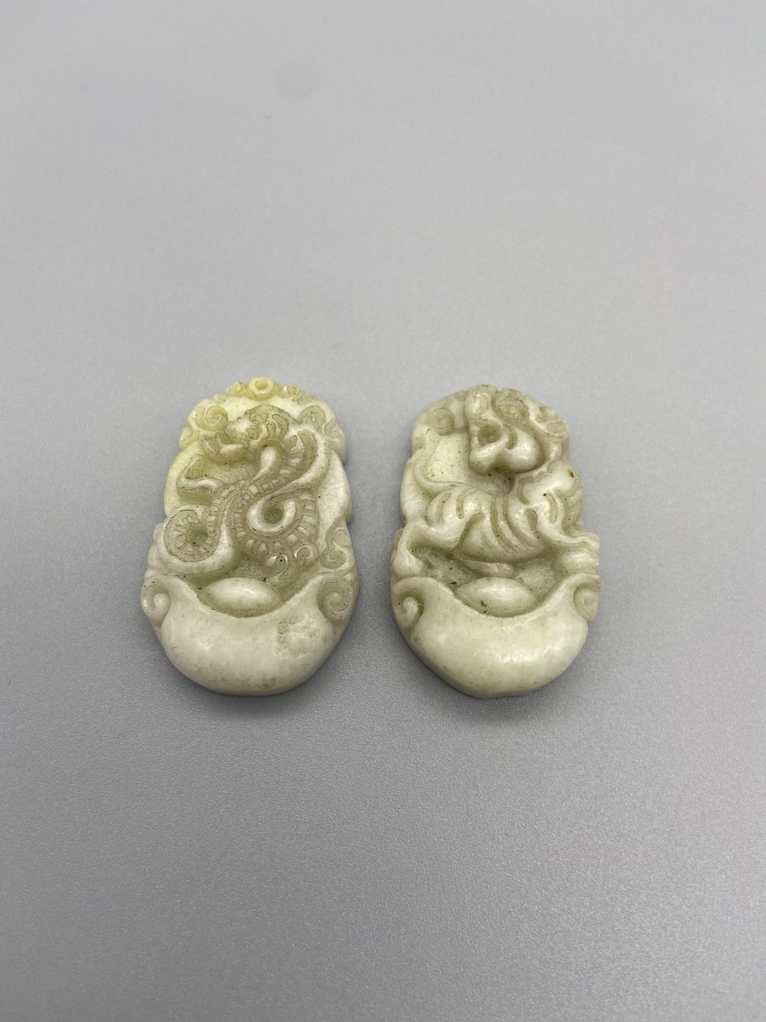 Two Chinese hand carved jade sculptures/ pendants detailing a snake and a tiger. [3.5cm in length]