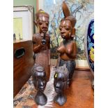 A Lot of four hand carved tribal bust figurines.