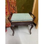 A Victorian cabriole leg piano stool with a lift up top.