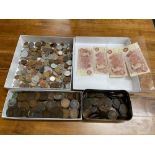 A Quantity of mixed world coins, two tubs of one pennies and four ten shilling notes.