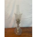 A Victorian cut crystal paraffin lamp set with an etched floral design shade. Comes with burning