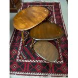 A Vintage set of three Ercol pebble tables.