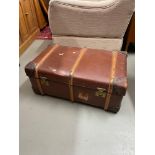 A large vintage wooden bound steamer travel trunk. Showing heavy duty brass locks. Comes with key.