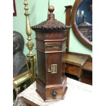 A letterbox made from mahogany wood with brass finishes. Ornate designed carved top. Comes with key.