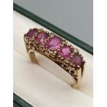 A Ladies Antique 9ct gold ring, set with 5 pink topaz stones & diamond chips [4 grams]