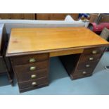 Antique solid oak knee hole writing desk. Designed with four drawers to each pedestal area.